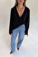 Black Carter V Neck long sleeve top with a fitted silhouette and soft fabric.