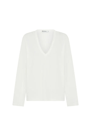 White Carter V Neck long sleeve top displayed on a mannequin with a fitted silhouette and soft fabric texture.
