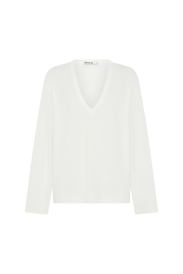 White Carter V Neck long sleeve top displayed on a mannequin with a fitted silhouette and soft fabric texture.