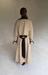 Beige Dakota Contrast Trench Coat with black lapels and belt, featuring a classic double-breasted design.