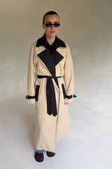 Beige Dakota Contrast Trench Coat with black lapels and belt, featuring a classic double-breasted design.
