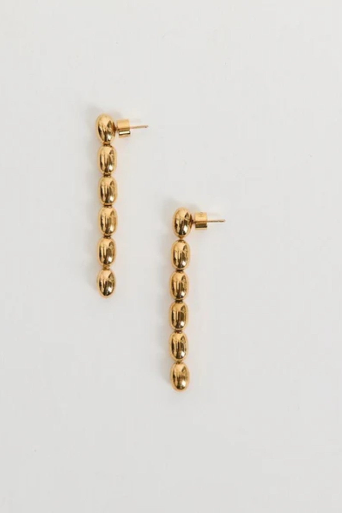 dith Earrings by Heaven Mayhem – gold twisted-bead drop earrings with sculptural movement and shine, perfect for refined everyday styling.