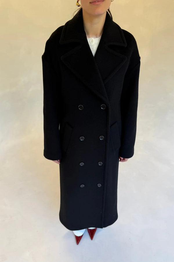 Black double-breasted coat with wide lapels and front buttons, designed for a tailored fit.