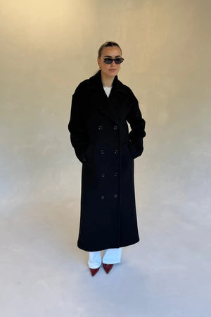 Black double-breasted coat with wide lapels and front buttons, designed for a tailored fit.