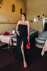 Jaz Strapless Split Maxi Dress in Black with a strapless neckline, sculpted waist, and side split creating a smooth, body hugging silhouette with a clean, contoured finish.