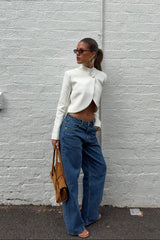 White cropped blazer top with long sleeves and a tailored fit from Ella Squire.