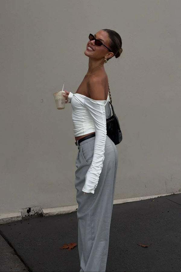 White off-shoulder top with ruffled neckline and short sleeves from Ella Squire.