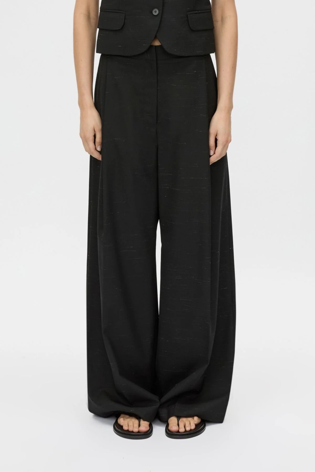 Aya Pant by Camilla and Marc in black, low-rise wool tailored design with subtle flare and pressed creases.