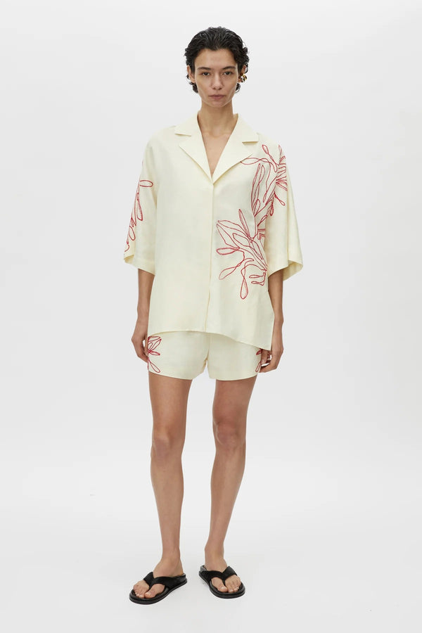 Eviva Shirt by Camilla and Marc – a lemon short-sleeve shirt with beaded embroidery and clean lines, perfect for bright polished days.