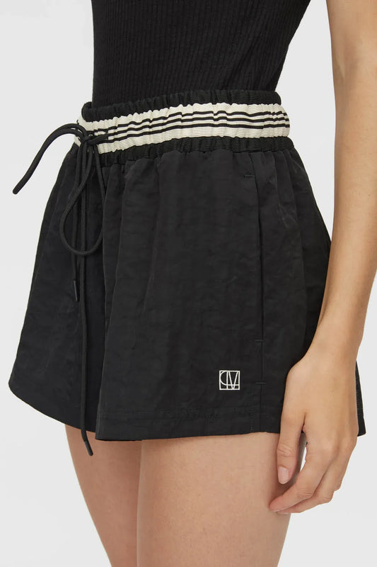 Mimas Monogram Short by Camilla and Marc in black, elasticated waist short with striped waistband and logo embroidery.