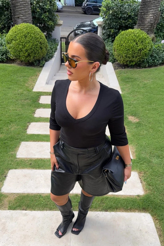 Black Jaz 3/4 sleeve V-neck jersey top displayed on a mannequin with a relaxed fit and soft fabric texture.