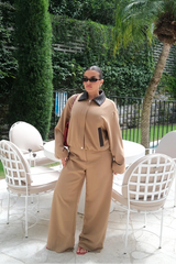 Tan and chocolate braided collar jacket with button front and long sleeves, displayed on a white background.