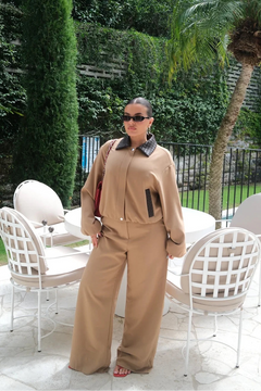 Tan and chocolate braided collar jacket with button front and long sleeves, displayed on a white background.