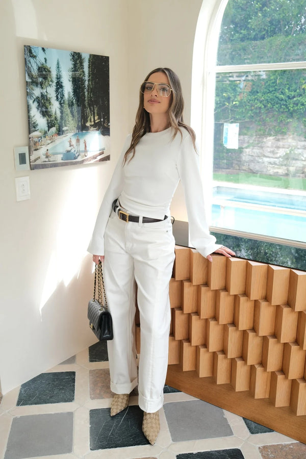 White Jaz crew neck top with ruched long sleeves and a fitted silhouette.