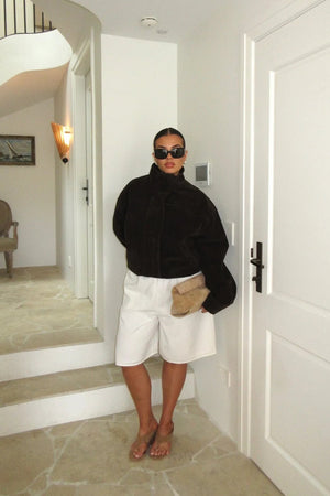 Jaz Mid Rise Bermuda Shorts in ivory color, featuring a relaxed fit and knee-length design.