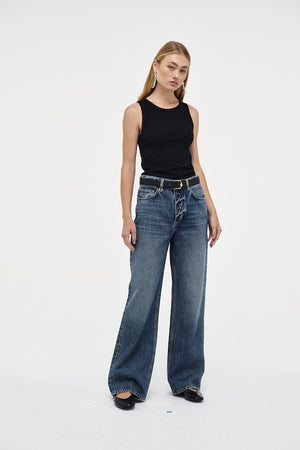 Coco Relaxed Psychocandy by Neuw Denim, trendy high-waisted jeans with a relaxed straight-leg fit and elongating silhouette. Perfect for a laid-back or tailored look in a mid-vintage indigo wash with signature Neuw Denim details.