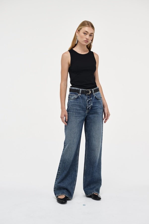 Coco Relaxed Psychocandy by Neuw Denim, trendy high-waisted jeans with a relaxed straight-leg fit and elongating silhouette. Perfect for a laid-back or tailored look in a mid-vintage indigo wash with signature Neuw Denim details.