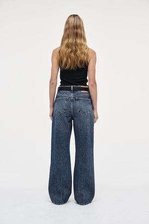 Coco Relaxed Psychocandy by Neuw Denim, trendy high-waisted jeans with a relaxed straight-leg fit and elongating silhouette. Perfect for a laid-back or tailored look in a mid-vintage indigo wash with signature Neuw Denim details.
