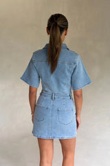 Light blue denim mini dress with short sleeves and a fitted silhouette.