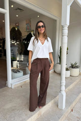 Kinsley Pinstripe Tailored Pant in chocolate with thin vertical white stripes and a slim, tailored fit.