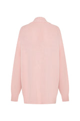 Soft pink oversized knit cardigan with long sleeves and a relaxed fit, perfect for layering.