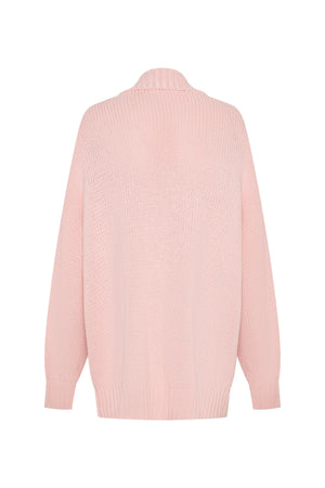 Soft pink oversized knit cardigan with long sleeves and a relaxed fit, perfect for layering.