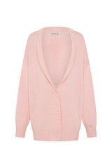 Soft pink oversized knit cardigan with long sleeves and a relaxed fit, perfect for layering.