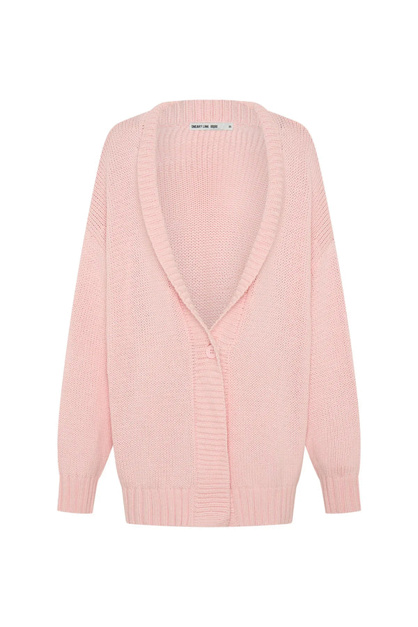 Soft pink oversized knit cardigan with long sleeves and a relaxed fit, perfect for layering.