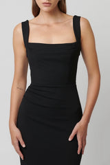 Marbella Gown Black by Effie Kats – A sleek black gown with bustier-inspired bodice, draped detail, and split hem for graceful movement.