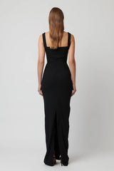 Marbella Gown Black by Effie Kats – A sleek black gown with bustier-inspired bodice, draped detail, and split hem for graceful movement.