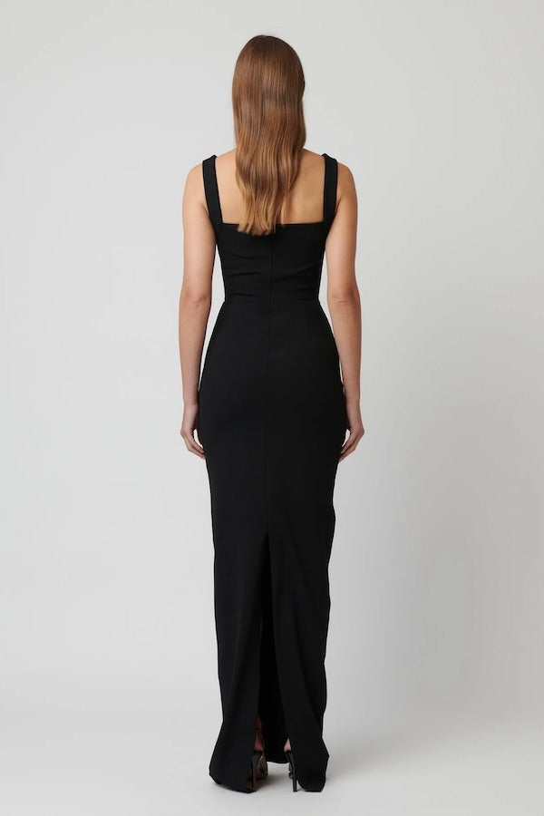 Marbella Gown Black by Effie Kats – A sleek black gown with bustier-inspired bodice, draped detail, and split hem for graceful movement.