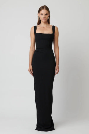 Marbella Gown Black by Effie Kats – A sleek black gown with bustier-inspired bodice, draped detail, and split hem for graceful movement.