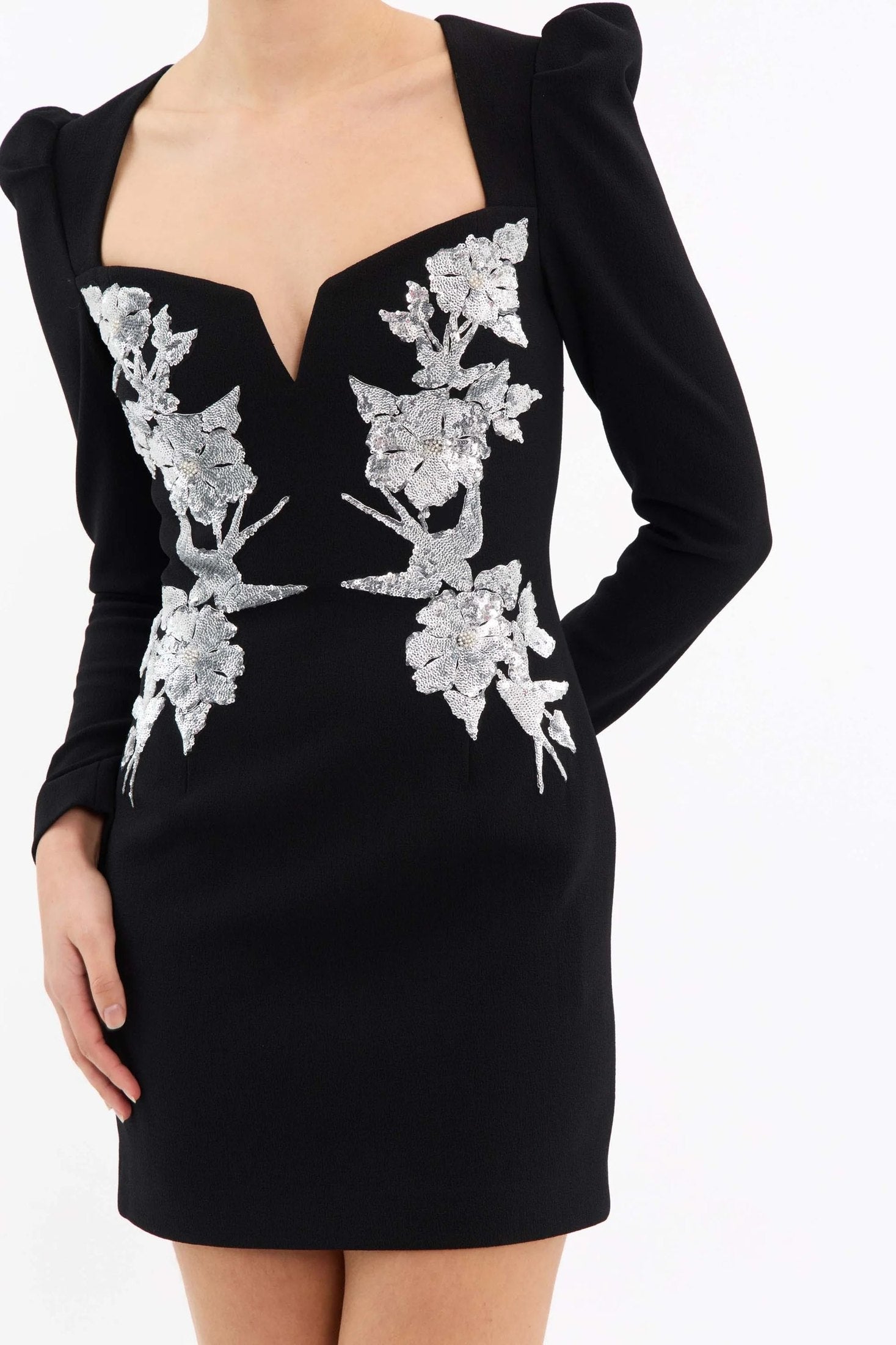 Monroe Long Sleeve Mini Dress Black by Rebecca Vallance – A striking crepe mini with silver sequin appliqué, V-wire neckline, and padded shoulders, perfect for cocktail parties, formal dinners, or glamorous date nights.