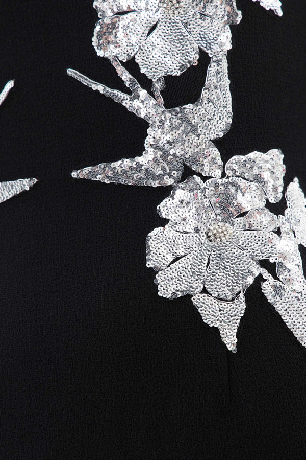 Monroe Long Sleeve Mini Dress Black by Rebecca Vallance – A striking crepe mini with silver sequin appliqué, V-wire neckline, and padded shoulders, perfect for cocktail parties, formal dinners, or glamorous date nights.