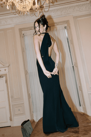 The Ultimate Muse Tie Neck Maxi Dress Black by Odd Muse – A trendy maxi with a romantic V-neckline, draped shoulders, and low back, perfect for bridal parties and elegant celebrations.