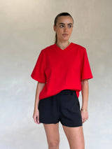 Red Olivia High V Neck Relaxed Tee displayed on a mannequin with short sleeves and a loose fit.