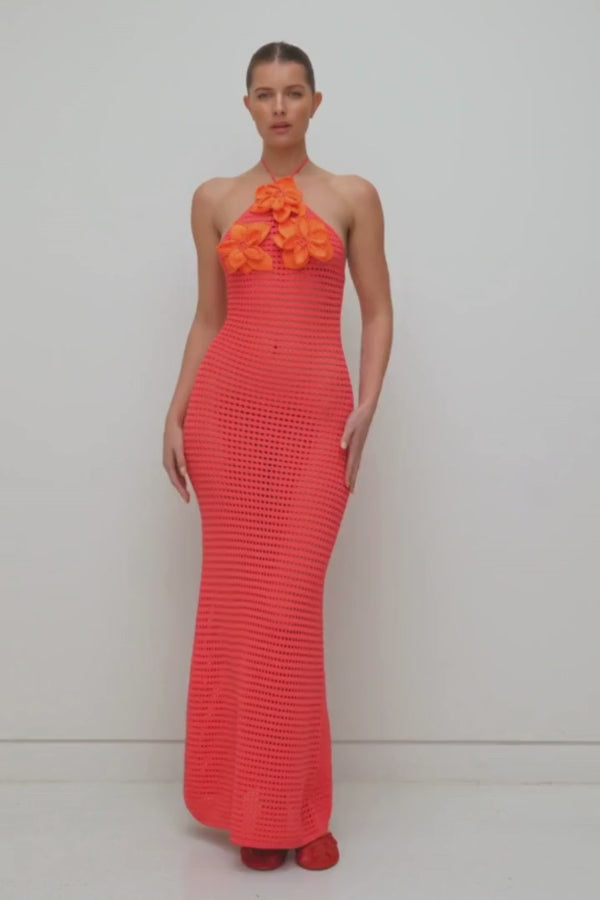 La Monada Knit Maxi Dress Coral by The Wolf Gang – A trendy one-shoulder knit maxi with bold cut-out, thigh-high split, and sculpted fit, perfect for casual or chic occasions.
