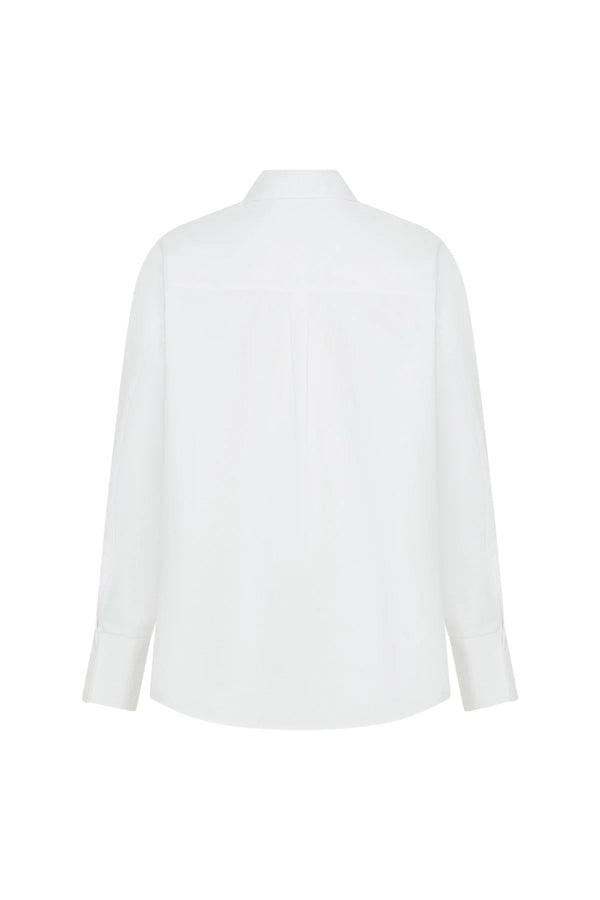 White oversized shirt with long sleeves and a relaxed fit, featuring a classic collar and button-down front.