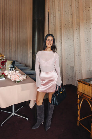 Pink Jaz A-Line satin mini skirt with a smooth, shiny finish and a flattering flared silhouette.