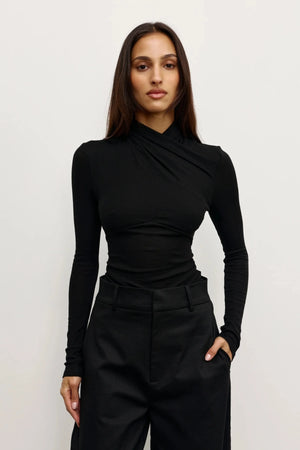 aTonia Top Black by Bayse – long sleeve top with draped neckline, self-tie detail and waist gathering.