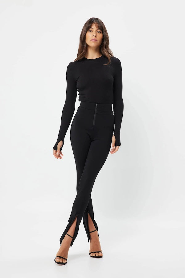 The Brooklyn Top Black by Mossman is a lightweight, fitted knit with a high round neckline and long sleeves with thumb openings.