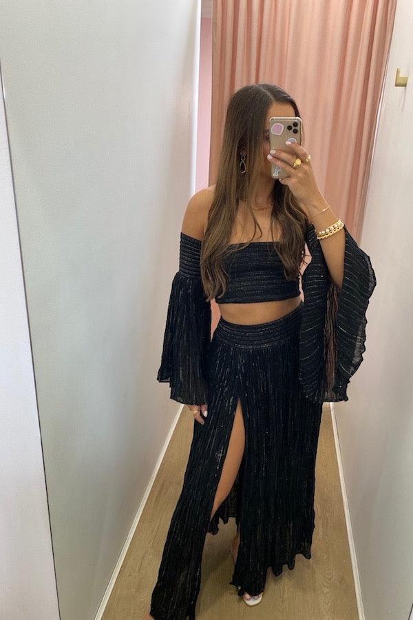 Calypso Skirt Black Gold by D Artemide, maxi skirt with shirred waist and front split. Perfect for beach days or effortless summer looks.
