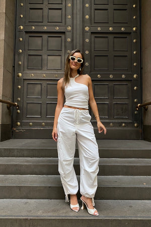 Cargo Link Pants White by Sneaky Link, versatile low-rise cargo pants with adjustable waist and hem ties for a laid-back or cuffed streetwear look.