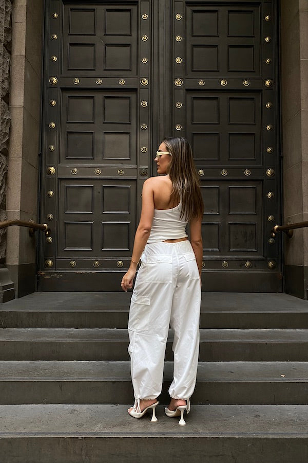 Cargo Link Pants White by Sneaky Link, versatile low-rise cargo pants with adjustable waist and hem ties for a laid-back or cuffed streetwear look.