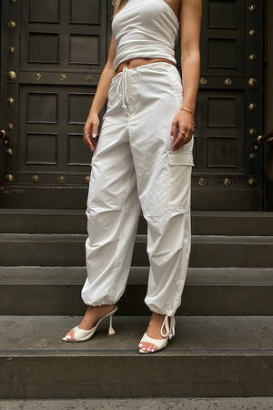 Cargo Link Pants White by Sneaky Link, versatile low-rise cargo pants with adjustable waist and hem ties for a laid-back or cuffed streetwear look.