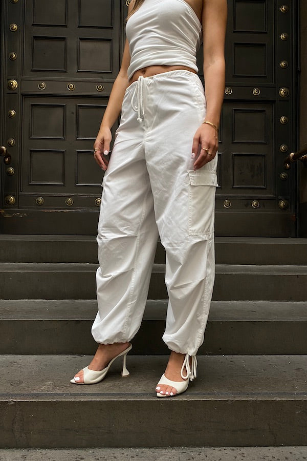Cargo Link Pants White by Sneaky Link, versatile low-rise cargo pants with adjustable waist and hem ties for a laid-back or cuffed streetwear look.