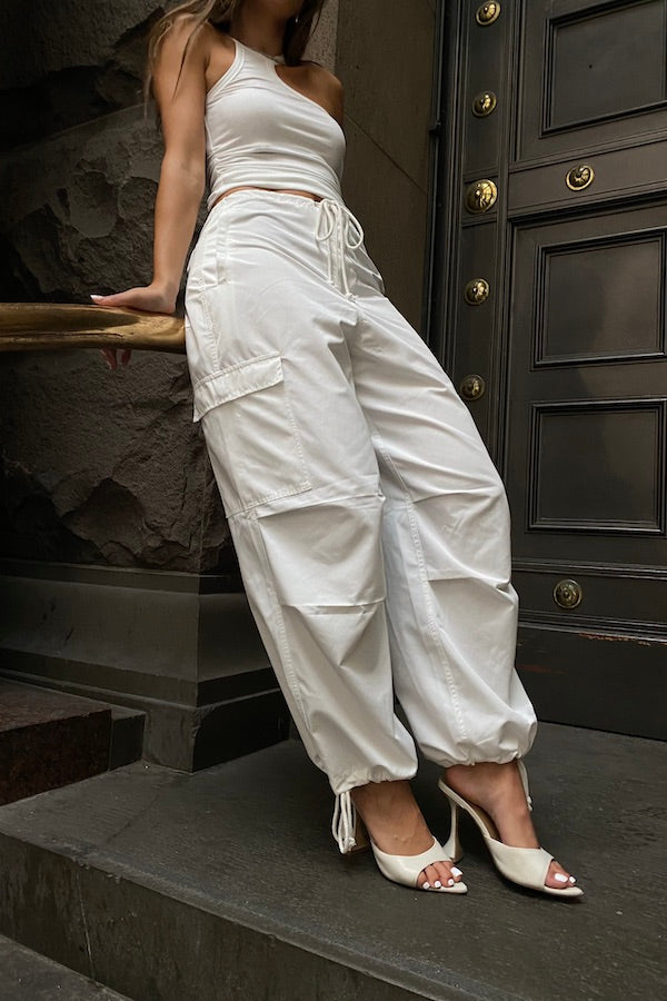 Cargo Link Pants White by Sneaky Link, versatile low-rise cargo pants with adjustable waist and hem ties for a laid-back or cuffed streetwear look.
