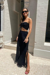 Ruched Tube Top Black by D’Artemide, Cotton bandeau with ruched back and front tie detail for easy summer layering or elevated resort styling.