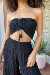 Ruched Tube Top Black by D’Artemide, Cotton bandeau with ruched back and front tie detail for easy summer layering or elevated resort styling.