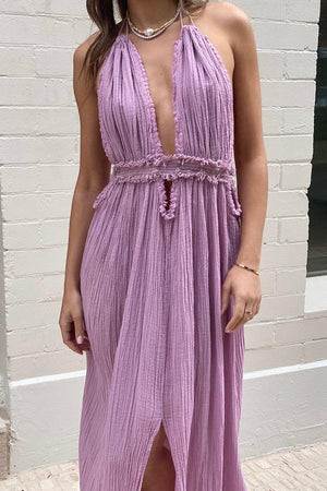 Lefkothea Dress Lilac by D’Artemide – A dreamy one-size cotton dress with halterneck, deep V, and low back, perfect for Sunday lunches or boat parties.